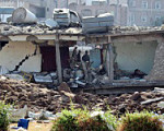 A two-storey building is seen after it was destroyed by an air strike in Yemen's central city of Ibb April 13, 2015.