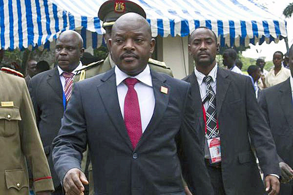 (FILES) - A file picture taken in Kampala on November 30, 2013 shows Burundi's President Pierre Nkurunziza arriving at Munyonyo resort Hotel to attend the 15th Ordinary Summit of the East African Community Heads of State. Burundi's presidency said an attempted coup by a top general had "failed" on May 13, 2015 and pro-president Burundi troops at state broadcaster fire warning shots over the heads of hundreds of protesters, an AFP reporter said. Burundian general Godefroid Niyombare on May 13 announced the overthrow of President Pierre Nkurunziza, following weeks of violent protests against the president's bid to stand for a third term.  AFP PHOTO / ISAAC KASAMANI