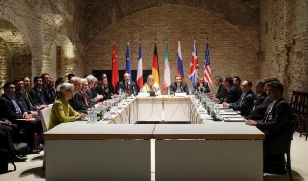 Negotiators of Iran and six world powers face each other at a table in the historic basement of Palais Coburg hotel in Vienna April 24, 2015.  REUTERS/Heinz-Peter Bader
