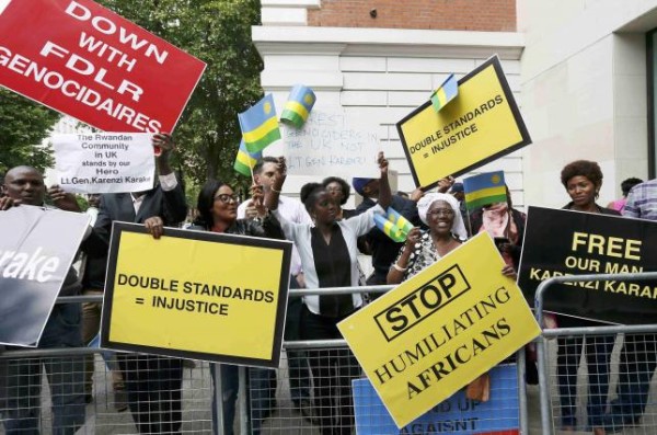 Protesters demanding the release of Rwanda's intelligence chief Karenzi Karake celebrate outside Westminster Magistrates Court after he was bailed for a bond of GB Pounds 1 Million in London, Britain June 25, 2015.  REUTERS/Stefan Wermuth