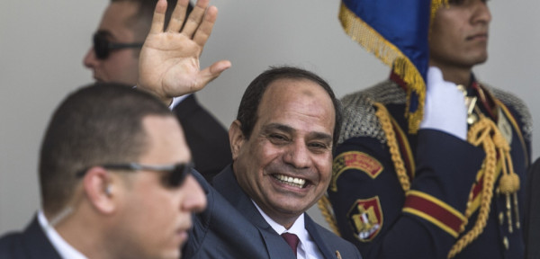Egyptian President Abdel Fattah al-Sisi  waves as he arrives for the opening ceremony of a new waterway at the Suez Canal on August 6, 2015, in the port city of Ismailiya. Sisi staged a lavish ceremony to unveil a "new" Suez Canal, seeking to boost the country's economy and international standing by expanding the vital waterway.  AFP PHOTO/ KHALED DESOUKI        (Photo credit should read KHALED DESOUKI/AFP/Getty Images)