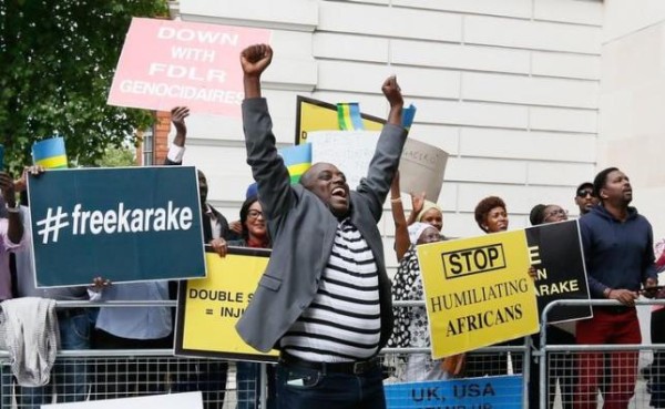 Protesters demanding the release of Rwanda's intelligence chief Karenzi Karake celebrate outside Westminster Magistrates Court after he was bailed for a bond of GB Pounds 1 Million in London, Britain June 25, 2015. REUTERS/Stefan Wermuth