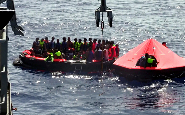 epa04873349 A framegrab made from a handout video released by the Irish Defence Forces on 05 August 2015 of migrants sitting in rhibs (rigid hull infraltable boats) during rescue operations by the Irish Navy patrol vessel 'Le Niamh' off the Libyan coast, 05 August 2015. A major rescue operation is under way after a boat with some 700 migrants capsized off Libya. Around 200 migrants are feared dead after a boat capsized off Libya, humanitarian agencies said. The incident took place some 22 nautical miles north of Zuwarah, a main departure point for migrants wanting to flee to Europe.  EPA/IRISH DEFENCE FORCES / HANDOUT BEST QUALITY AVAILABLE, MANDATORY CREDIT: Irish Defence Forces HANDOUT EDITORIAL USE ONLY/NO SALES