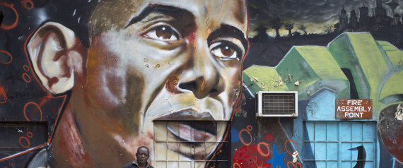 FILE - In this Wednesday, July 22, 2015 file photo, a man walks away after leaning his bicycle against a mural of President Barack Obama, created by the Kenyan graffiti artist Bankslave, at the GoDown Arts Centre in Nairobi, Kenya.  President Barack Obamas historic visit to Kenya and Ethiopia, which concluded Tuesday July 28, 2015, was marked by stirring images of throngs of thousands coming out to cheer the motorcade for this first visit by a sitting American president. (AP Photo/Ben Curtis, File)