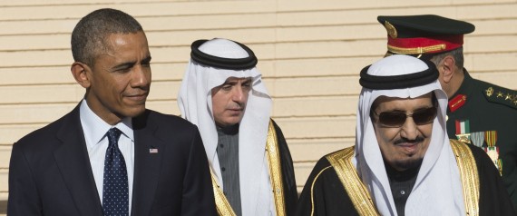 US President Barack Obama stands alongside Saudi new King Salman (R) after arriving on Air Force One at King Khalid International Airport in the capital Riyadh on January 27, 2015. Obama landed in Saudi Arabia to shore up ties with new King Salman and offer condolences after the death of his predecessor Abdullah. AFP PHOTO / SAUL LOEB        (Photo credit should read SAUL LOEB/AFP/Getty Images)