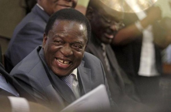 Zimbabwe Vice-President Emmerson Mnangagwa listens as President Robert Mugabe delivers his state of the nation address to the country's parliament in Harare, August 25, 2015. REUTERS/Philimon Bulawayo