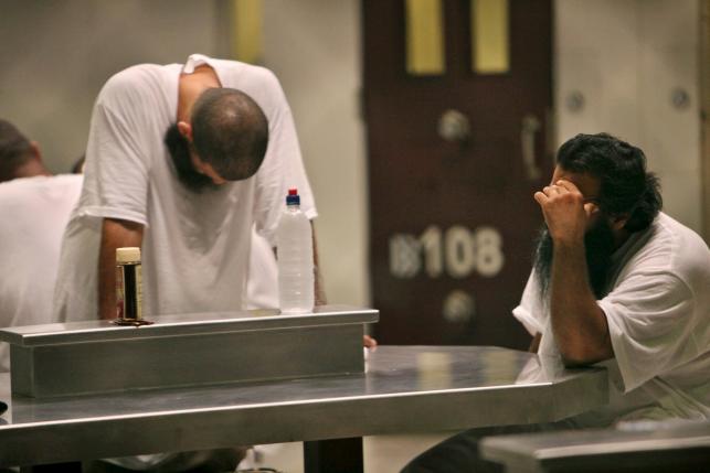 Detainees are seen inside the Camp 6 detention facility at Guantanamo Bay U.S. Naval Base in Cuba in this May 31, 2009 file photo. REUTERS/Brennan Linsley/Pool/Files