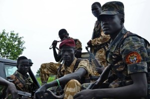 South Sudanese SPLA soldiers are pictured in Pageri in Eastern Equatoria state on August 20, 2015. The spokesman of SPLA, Colonel Philip Aguer visited the area after the government claimed to be back in control of the area following an attack by rebel forces. South Sudan's civil war began in December 2013 when Kiir accused his former deputy Riek Machar of plotting a coup, setting off a cycle of retaliatory killings that has split the poverty-stricken country along ethnic lines. The government says they will return to talks in Ethiopia in early September to "finalise" a peace deal. AFP PHOTO / SAMIR BOL (Photo credit should read SAMIR BOL/AFP/Getty Images)