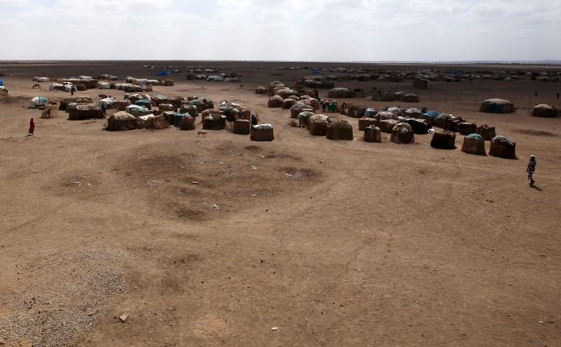 A small village is seen at a distance in Farado Kebele, one of drought stricken Somali region in Ethiopia, January 26, 2016. REUTERS/Tiksa Negeri