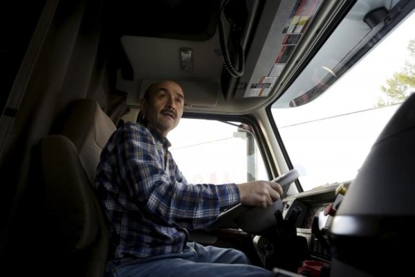 Truck driver Kurban drives his truck in Buena Park, California December 11, 2015. REUTERS/Jonathan Alcorn