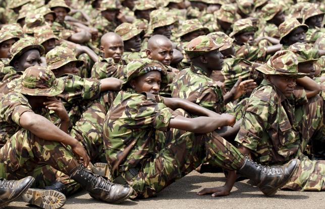 Members of the Kenya Defence Forces attend prayers as they pay their respects to the Kenyan soldiers serving in the African Union Mission in Somalia (AMISOM), who were killed in El Adde during an attack, at a memorial mass at the Moi Barracks in Eldoret, January 27, 2016. REUTERS/Thomas Mukoya