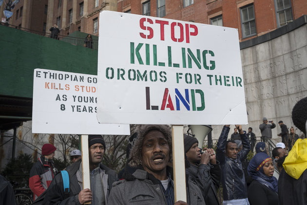 MANHATTAN, NEW YORK, NY, UNITED STATES - 2016/01/15: A demonstrator holds a sign while demonstrating opposite United Nations Headquarters. Several hundred Ethiopian-American demonstrators from around the U.S. gathered opposite United Nations Headquarters in New York City to express their anger over the recent deaths of over 140 protesters in Ethiopia at the hands of government security forces sent to contain the protests over the Addis Abba "master plan.". (Photo by Albin Lohr-Jones/Pacific Press/LightRocket via Getty Images)