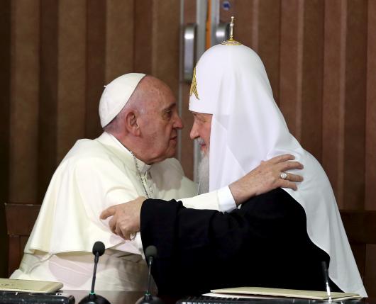 Pope Francis (L) and Russian Orthodox Patriarch Kirill hug each other after signing agreements in Havana, February 12, 2016. REUTERS/Alejandro Ernesto/Pool