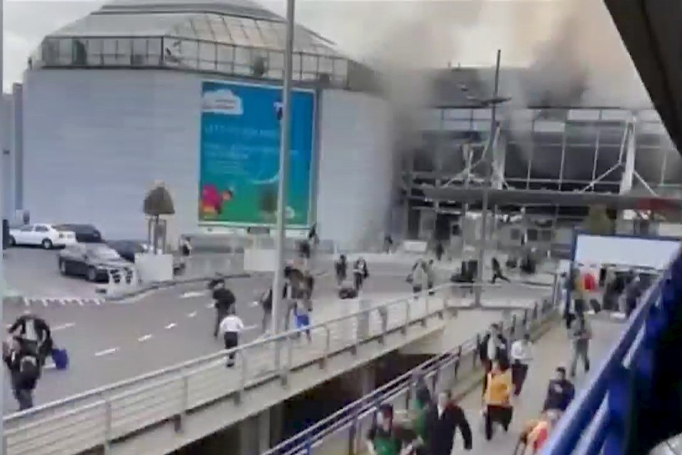 People flee from the Brussels airport in this image taken from video, shot by a bystander in the the immediate aftermath of blasts at the airport near Brussels, Belgium, March 22, 2016. Courtesy Asher Gunsberg REUTERS/Asher Gunsberg/Handout via Reuters TV TPX IMAGES OF THE DAY ATTENTION EDITORS - THIS IMAGE HAS BEEN SUPPLIED BY A THIRD PARTY. REUTERS IS UNABLE TO INDEPENDENTLY VERIFY THE AUTHENTICITY, CONTENT, LOCATION OR DATE OF THIS IMAGE. FOR EDITORIAL USE ONLY. NOT FOR SALE FOR MARKETING OR ADVERTISING CAMPAIGNS. FOR EDITORIAL USE ONLY. NO RESALES. NO ARCHIVE. THIS PICTURE IS DISTRIBUTED EXACTLY AS RECEIVED BY REUTERS, AS A SERVICE TO CLIENTS. - RTSBOIB