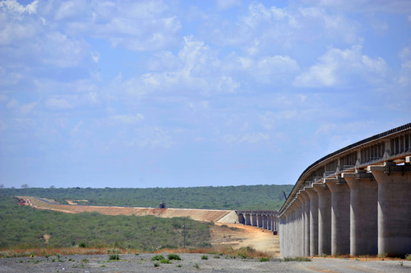 New laid rail track stretches across the Tsavo superbridge which will form part of the new Mombasa-Nairobi Standard Gauge Railway (SGR) line across the national park in Tsavo, Kenya, on Wednesday, March 16, 2016. By providing an alternative to roads, the 1,100-kilometer (684-mile) Chinese-financed railway will slash the time and cost of transporting people and goods between East Africa's landlocked nations. Photographer: Riccardo Gangale/Bloomberg