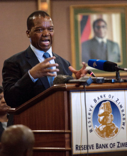 Governor of Reserve Bank of Zimbabwe (RBZ) John Mangudya presents his 2016 Monetary Policy Statement after declaring the country lost USD1.8 billion through illicit money transfers, in Harare, on February 4, 2016. / AFP / JEKESAI NJIKIZANA        (Photo credit should read JEKESAI NJIKIZANA/AFP/Getty Images)