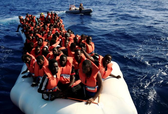An overcrowded dinghy with migrants from different African countries is followed by members of the German NGO Jugend Rettet as they approach the Iuventa vessel during a rescue operation, off the Libyan coast in the Mediterranean Sea  September 21, 2016. REUTERS/Zohra Bensemra